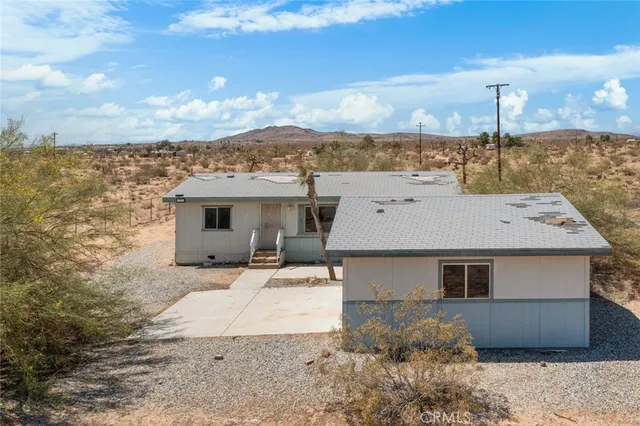 a aerial view of a house with a yard