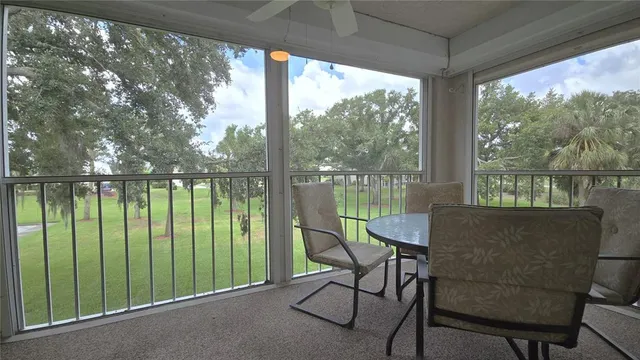 a balcony view with a lake view and a floor to ceiling window
