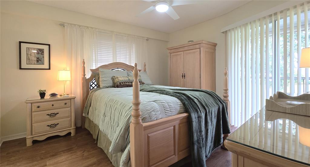 6501 Stone River Road, Unit 201 Bradenton, FL 34203 - Photo 9 of 18 a bed sitting in a bedroom next to a window