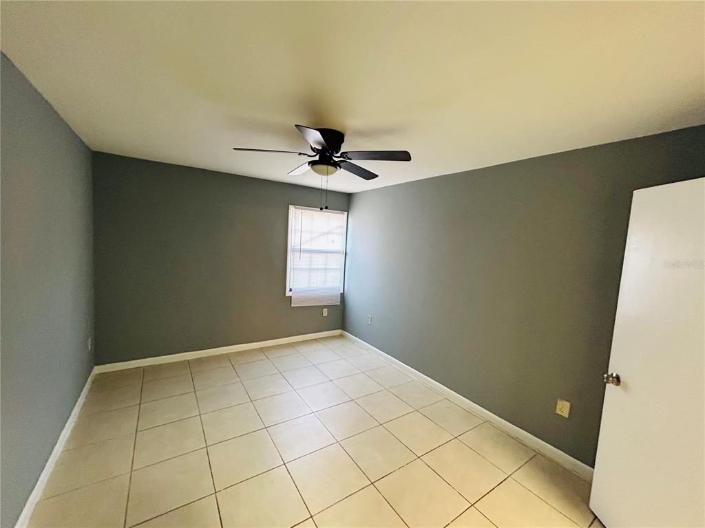 2785 L B McLeod Road, Unit B Orlando, FL 32805 - Photo 9 of 11 a view of an empty room and window