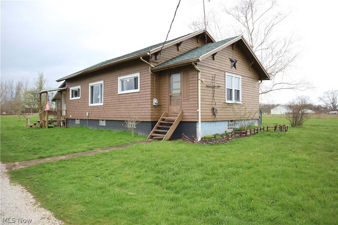 2212 Sentinel Road Dorset, OH 44032 - Photo 2 of 24 Rear view of house with a lawn