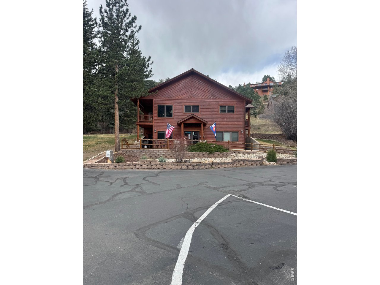2100 Fall River Road, Unit 4 Estes Park, CO 80517 - Photo 27 of 28 a view of a house with a yard
