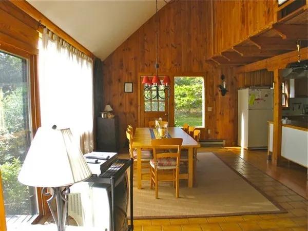 a view of a dining room with furniture window and outside view