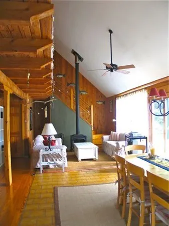 a very nice looking dining room with a large window