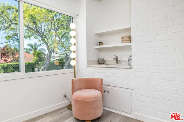 a bathroom with a toilet and a window