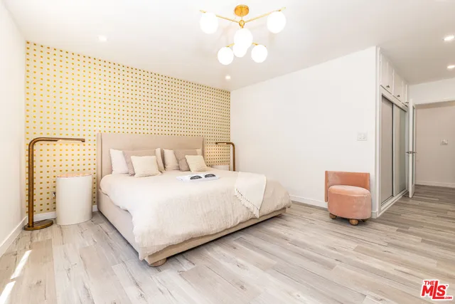 a bedroom with a bed and a couch