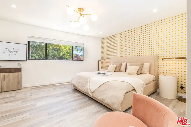 a bedroom with bed and window