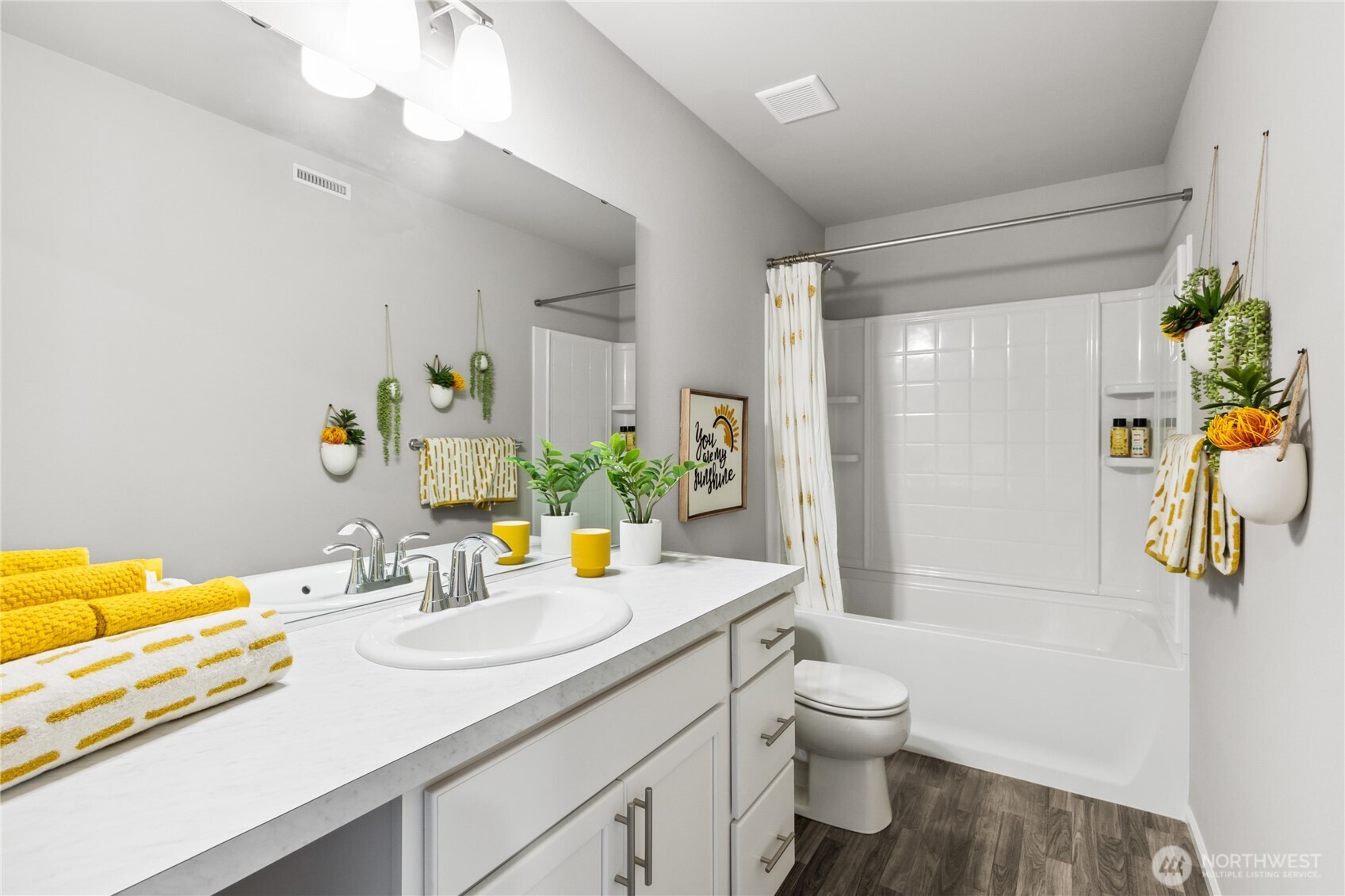 13434 323rd Avenue Southeast Sultan, WA 98294 - Photo 25 of 28 a bathroom with a granite countertop sink and a blue shower
