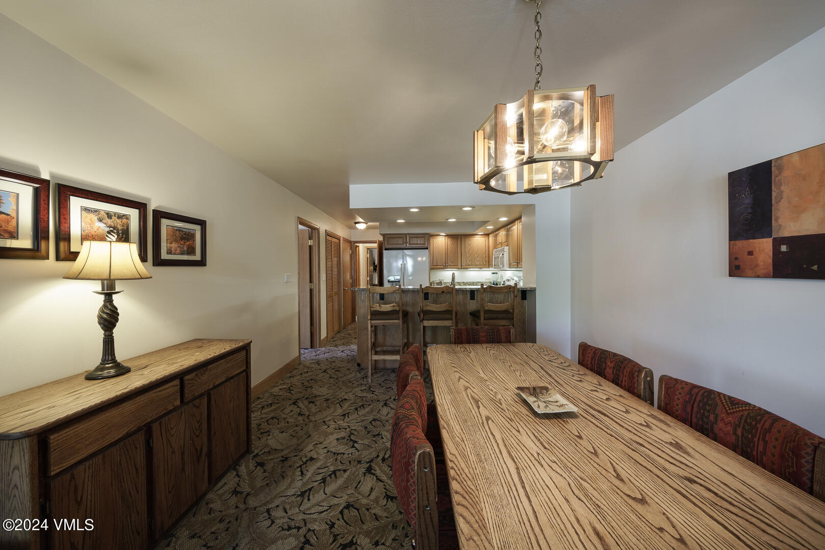 707 West Lionshead Circle, Unit 118 Vail, CO 81657 - Photo 12 of 29 a bedroom with bed and wooden floor