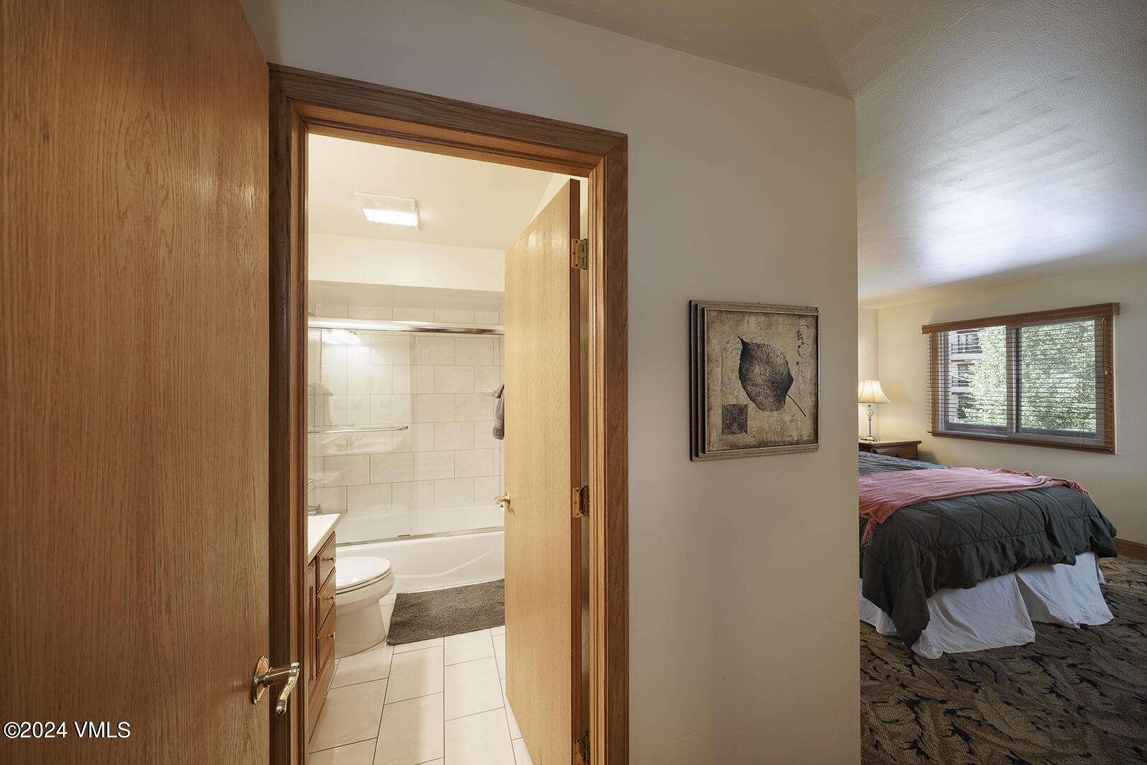 707 West Lionshead Circle, Unit 118 Vail, CO 81657 - Photo 18 of 29 a bedroom with a bed and a window