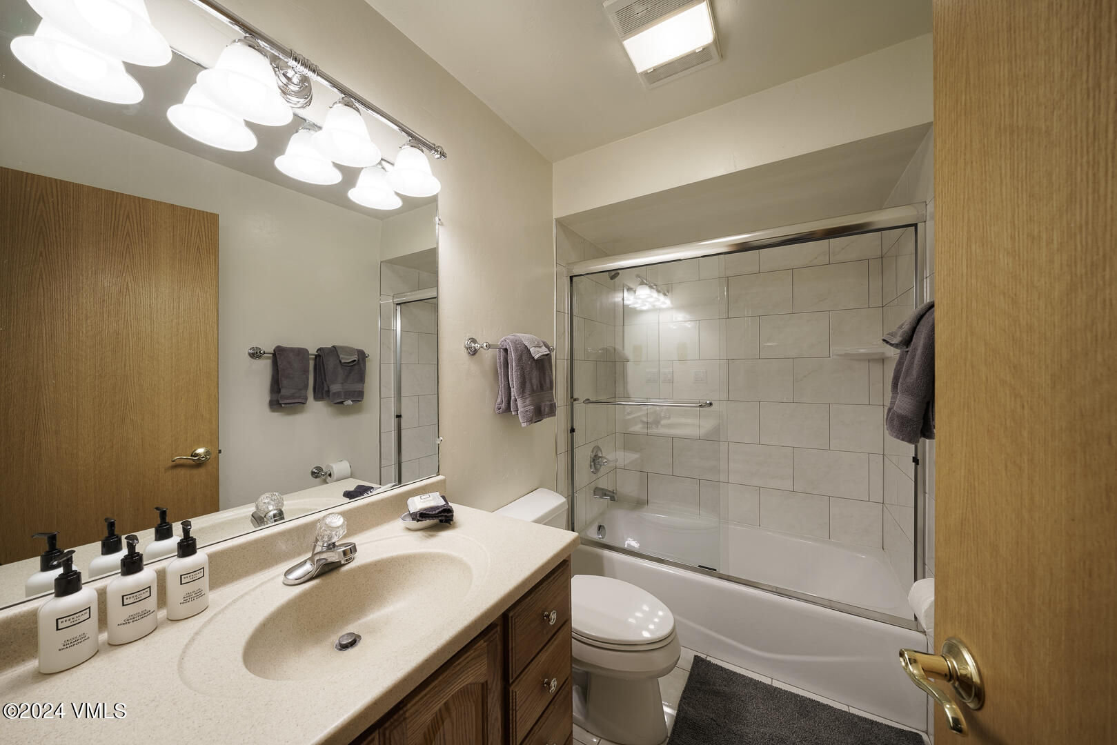 707 West Lionshead Circle, Unit 118 Vail, CO 81657 - Photo 19 of 29 a bathroom with a sink mirror toilet and shower
