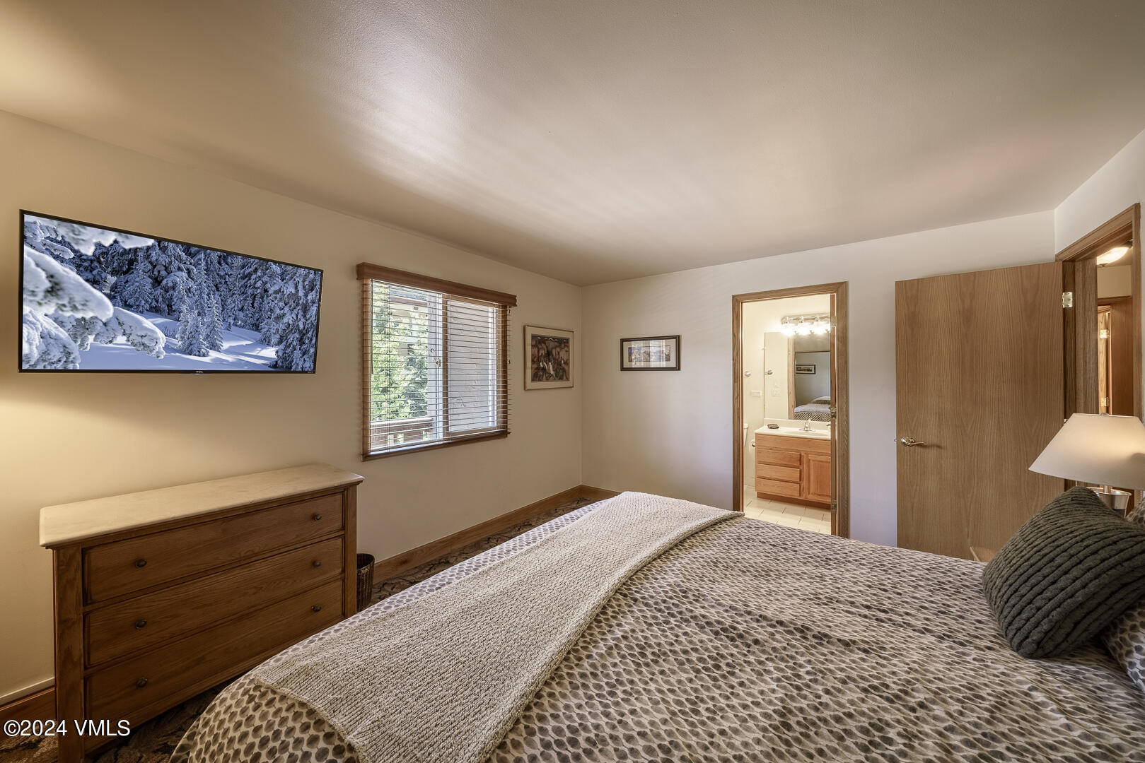 707 West Lionshead Circle, Unit 118 Vail, CO 81657 - Photo 27 of 29 a bedroom with a bed and a window