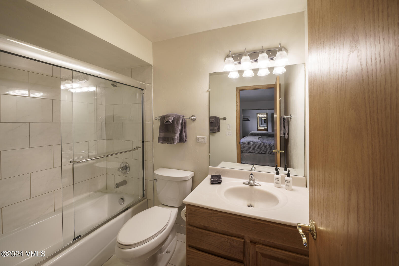 707 West Lionshead Circle, Unit 118 Vail, CO 81657 - Photo 28 of 29 a bathroom with a toilet a sink and mirror