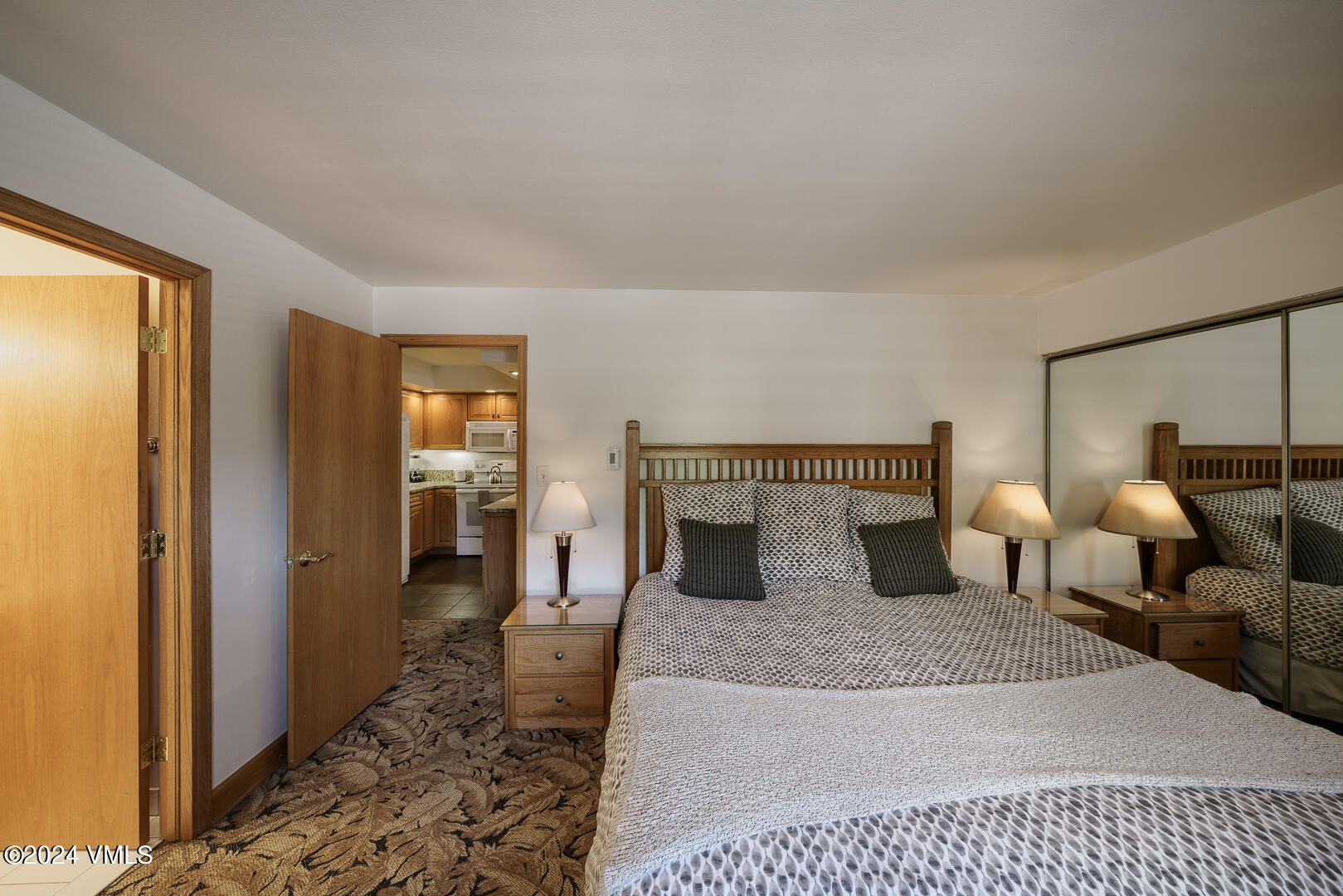 707 West Lionshead Circle, Unit 118 Vail, CO 81657 - Photo 29 of 29 a bedroom with furniture and a rug