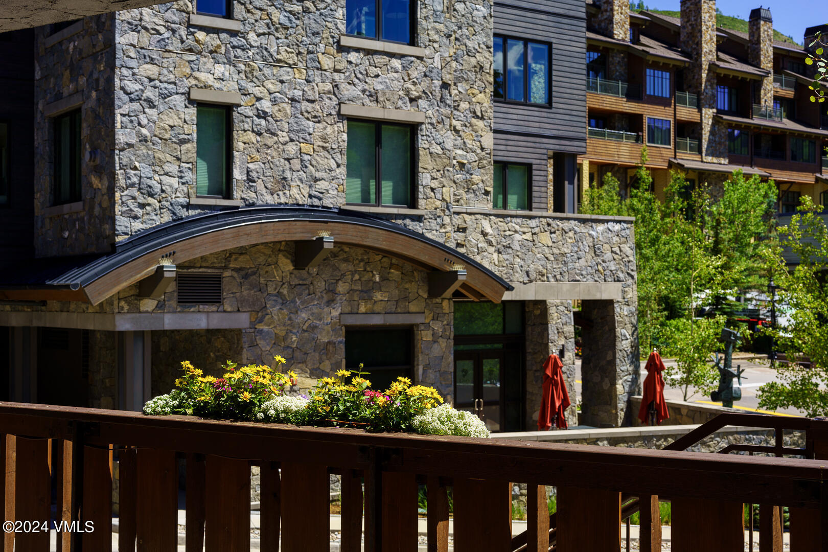 707 West Lionshead Circle, Unit 118 Vail, CO 81657 - Photo 4 of 29 a front view of a house with a garden