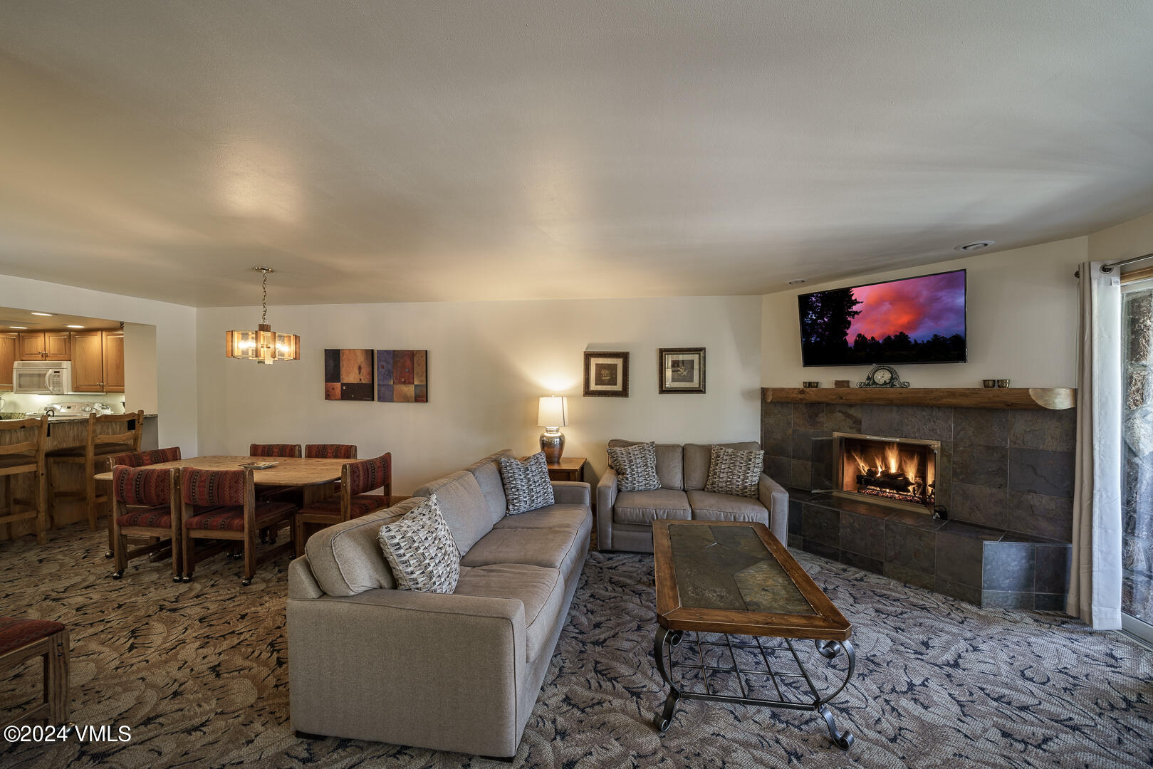 707 West Lionshead Circle, Unit 118 Vail, CO 81657 - Photo 7 of 29 a living room with furniture and a fireplace