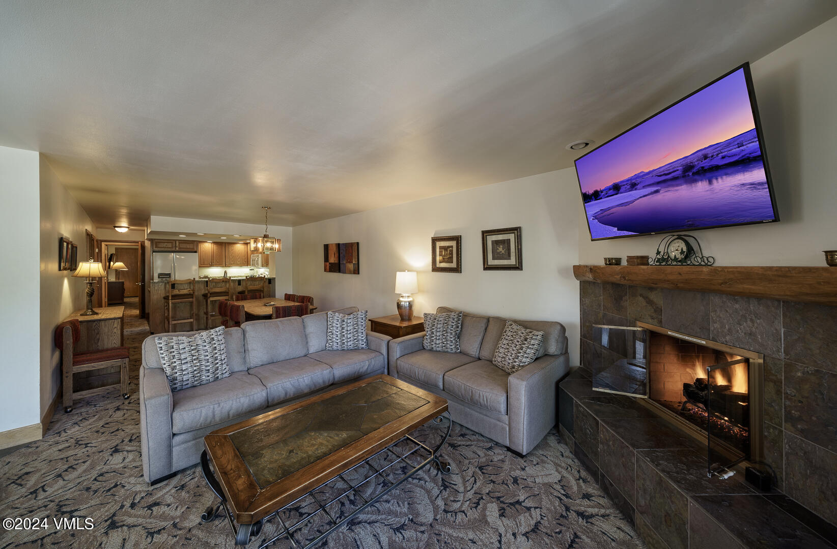 707 West Lionshead Circle, Unit 118 Vail, CO 81657 - Photo 9 of 29 a living room with furniture and a fireplace