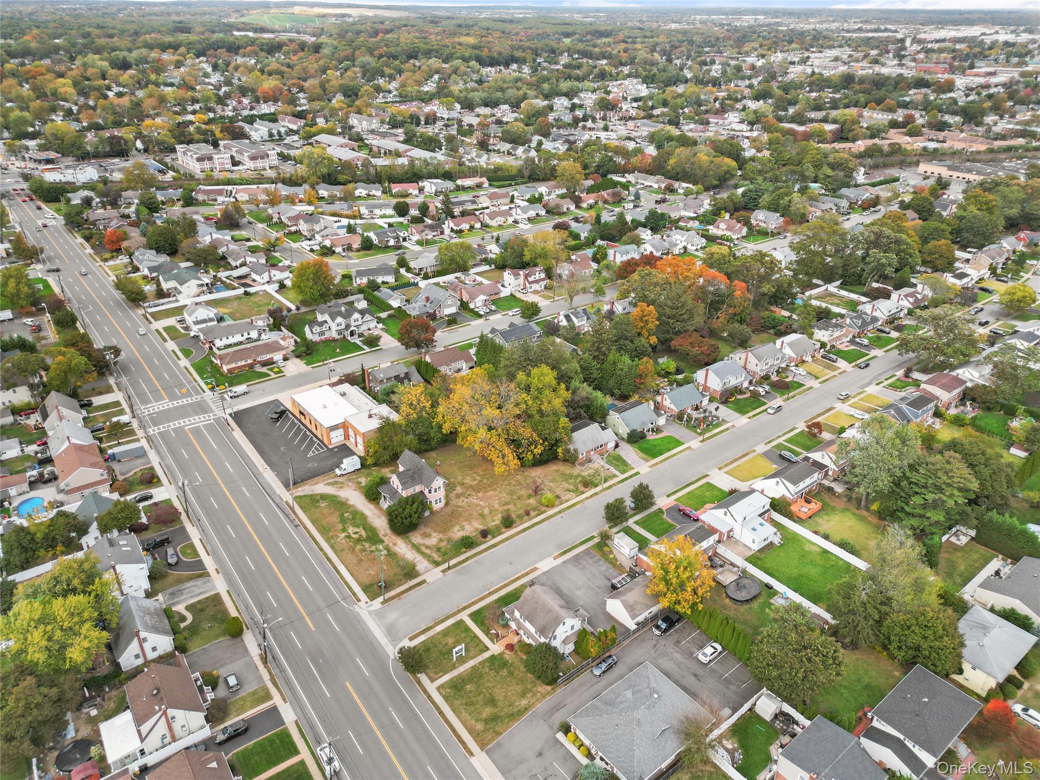 9 Tudor Road Farmingdale, NY 11735 - Photo 11 of 12 an aerial view of residential houses with outdoor space