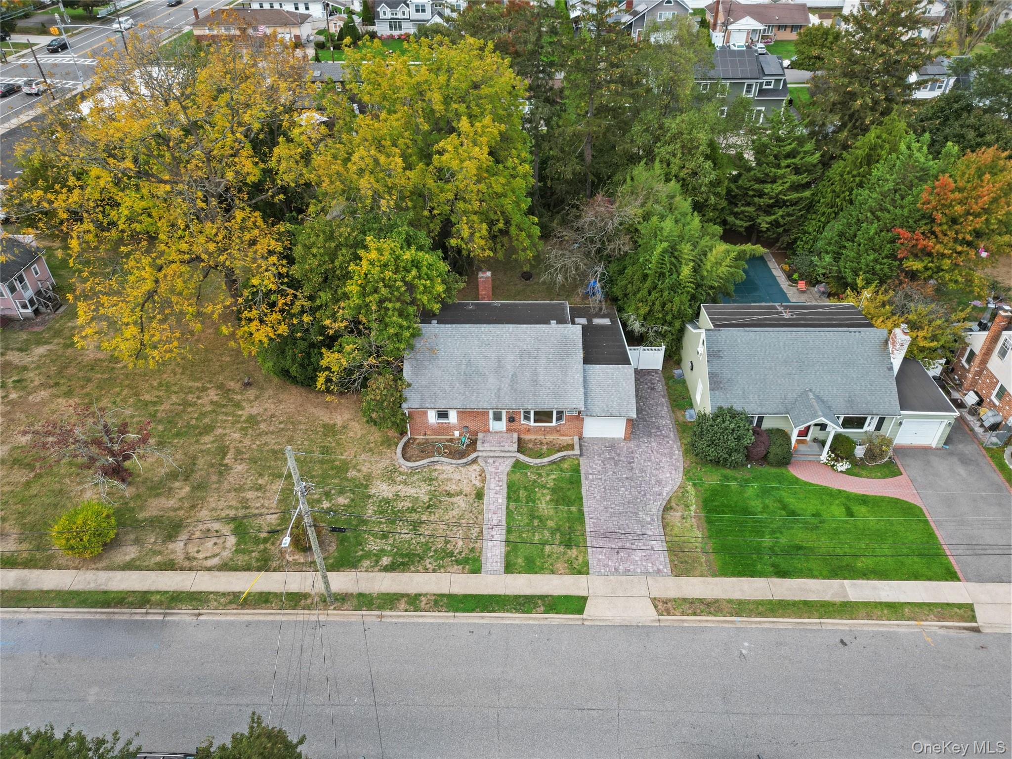 9 Tudor Road Farmingdale, NY 11735 - Photo 7 of 12 front view of house with a yard