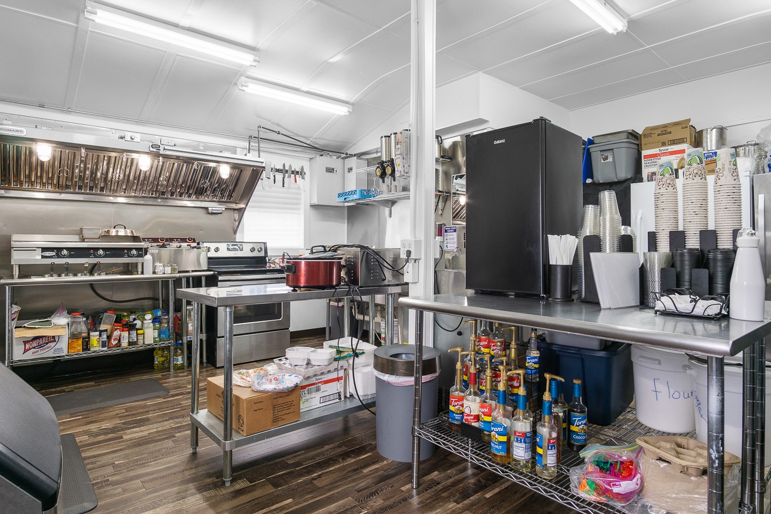1136 Highway 87 Crystal Beach, TX 77650 - Photo 12 of 33 a room with lots of wooden furniture and a baby crib