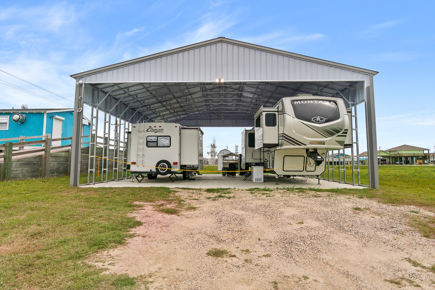 1136 Highway 87 Crystal Beach, TX 77650 - Photo 2 of 33 a front view of a house with garden