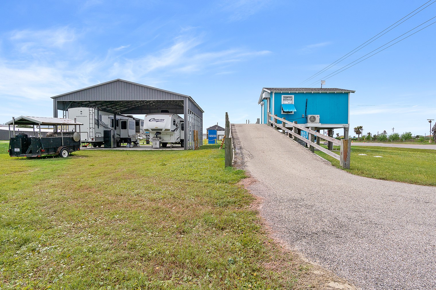 1136 Highway 87 Crystal Beach, TX 77650 - Photo 28 of 33 a view of a house with a yard and sitting area