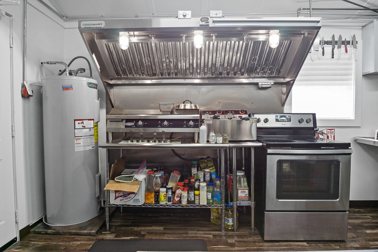 1136 Highway 87 Crystal Beach, TX 77650 - Photo 6 of 33 a view of washer and dryer with wooden cabinets