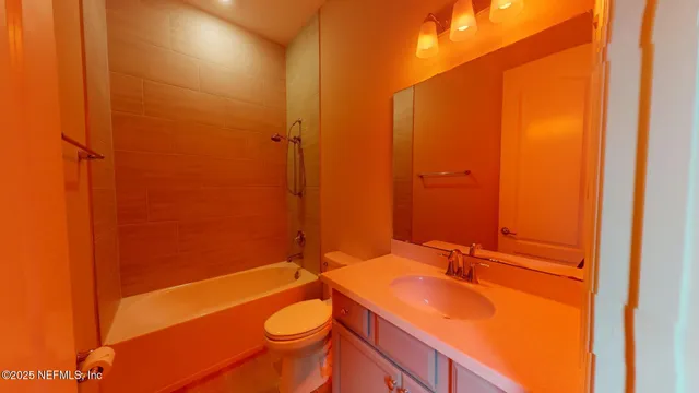a bathroom with a double vanity sink and mirror