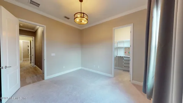 a bathroom with a double vanity sink and mirror