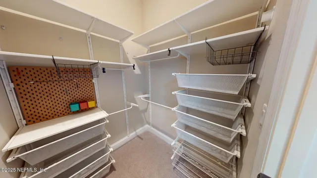 a bathroom with a double vanity sink mirror and shower