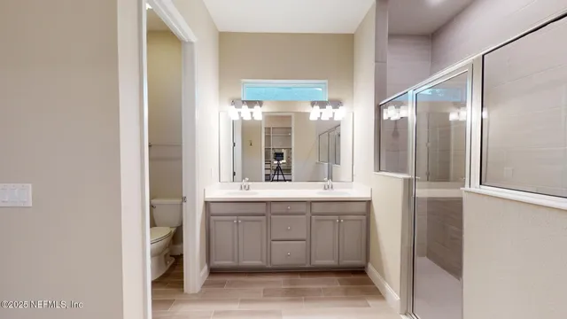 a very nice looking living room with lots of furniture and a large window