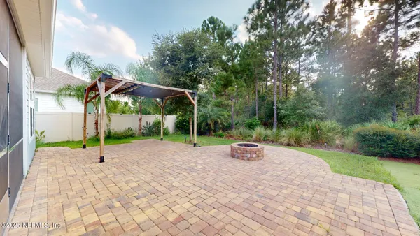 a view of a house with swimming pool and a garden