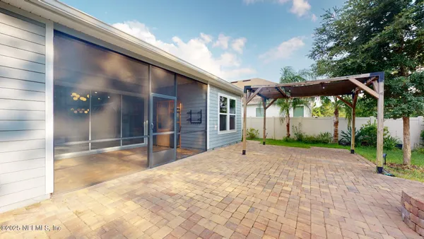 a very nice looking living room with lots of furniture and a large window