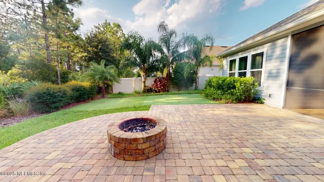 a swimming pool with outdoor seating yard and barbeque oven