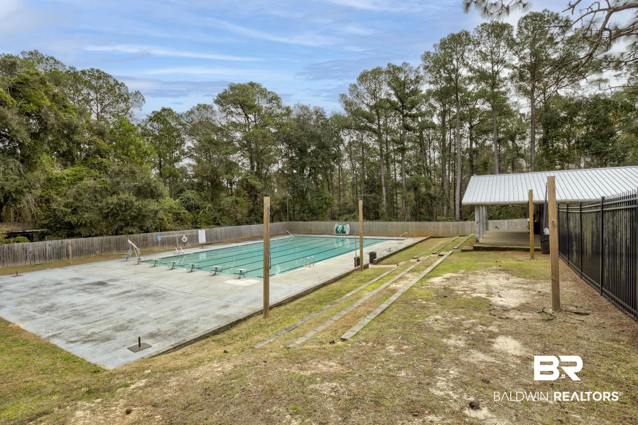 332 Ridgewood Drive Daphne, AL 36526 - Photo 41 of 48 Community pool with view of scattered trees