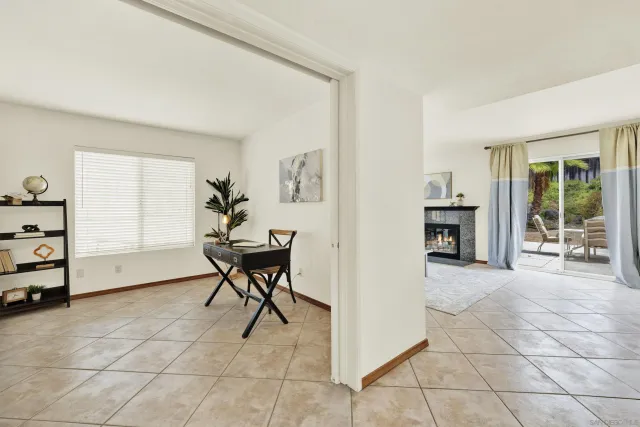 a view of a hallway with furniture and window