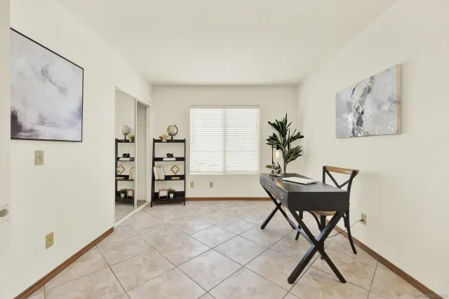 a bedroom with a large bed and a couch