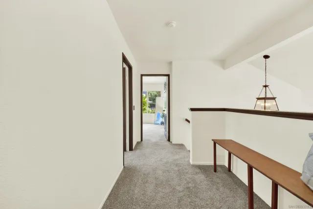 a bedroom with bed and wooden floor