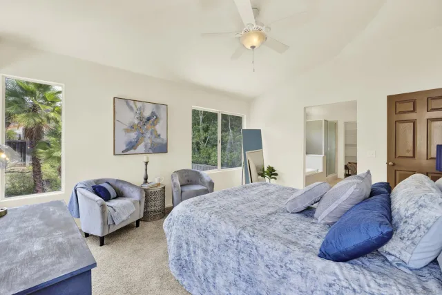 a bathroom with a toilet a sink and tub