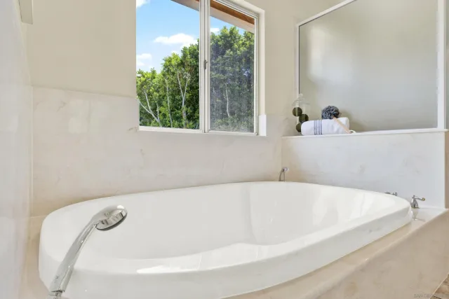 a view of a bedroom with a large bed and a couch
