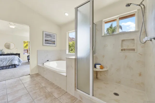 a bedroom with furniture and a window