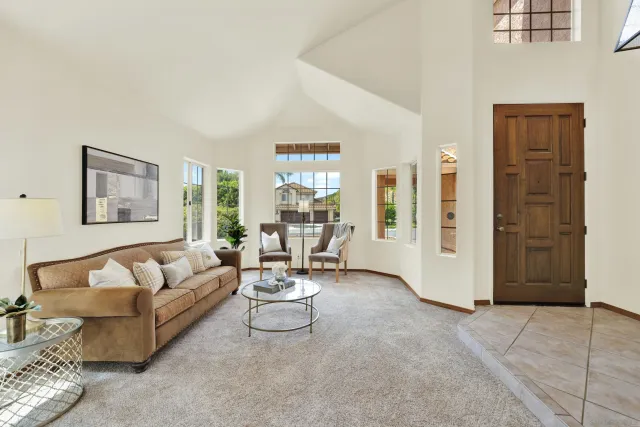 a dining room with furniture and entryway