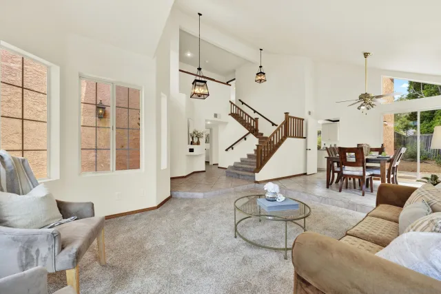 a view of a dining room with furniture and window