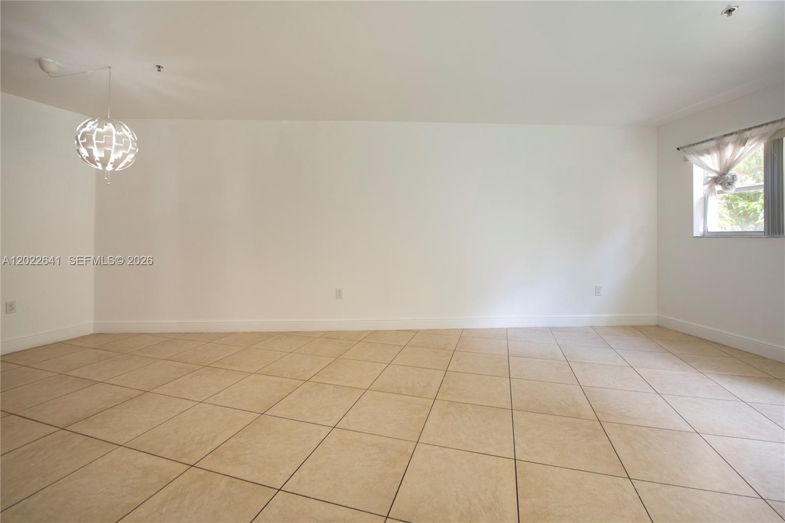 4147 Stirling Road, Unit 105 Dania Beach, FL 33314 - Photo 10 of 16 an empty room with windows