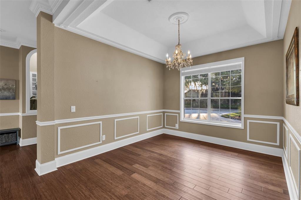 1425 Riviera Drive Kissimmee, FL 34744 - Photo 8 of 82 a view of an empty room with wooden floor and a window