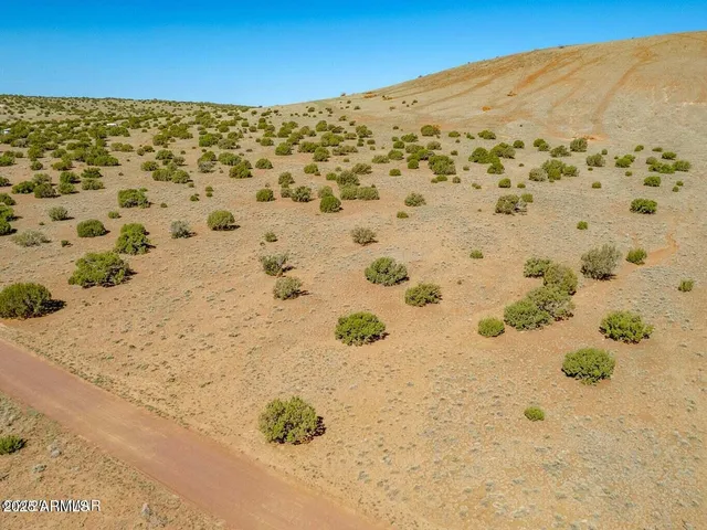 a view of a pool table and chairs