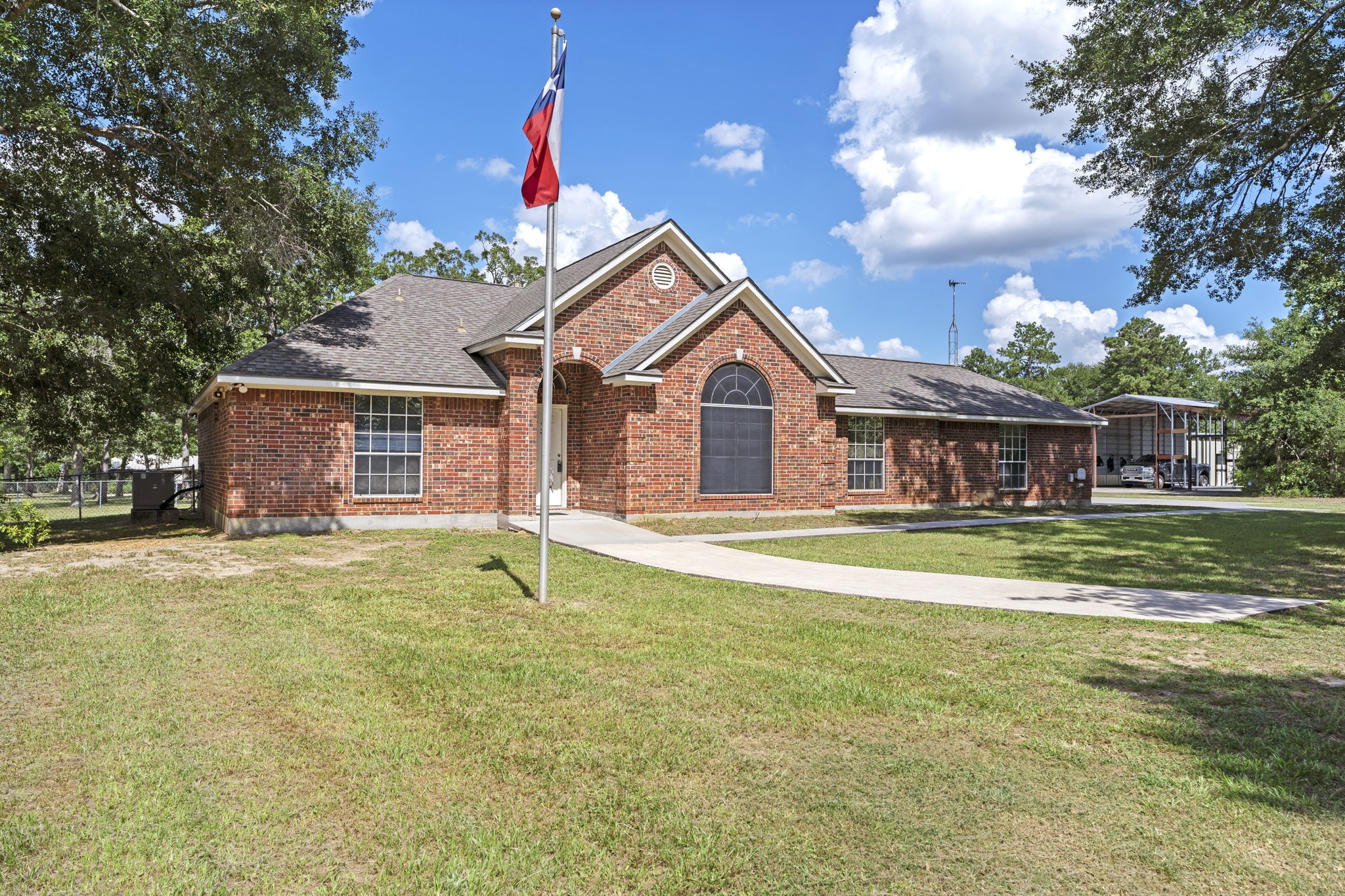 11534 Clint Parker Road Conroe, TX 77303 - Photo 2 of 50 a view of a house with swimming pool and a yard