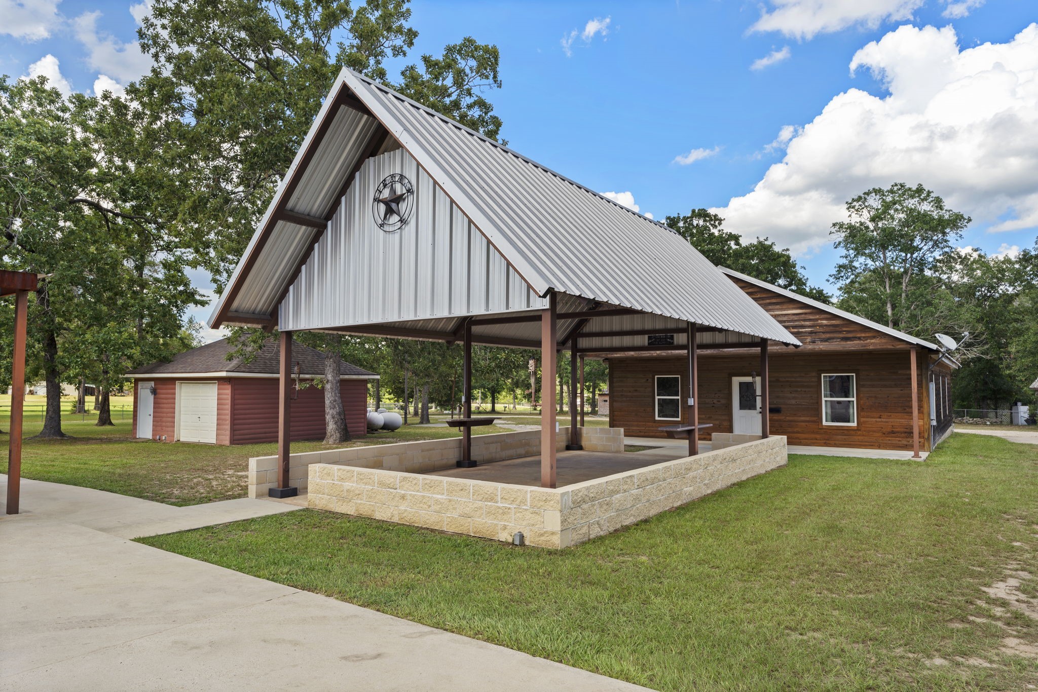 11534 Clint Parker Road Conroe, TX 77303 - Photo 24 of 50 a front view of house with yard and outdoor seating