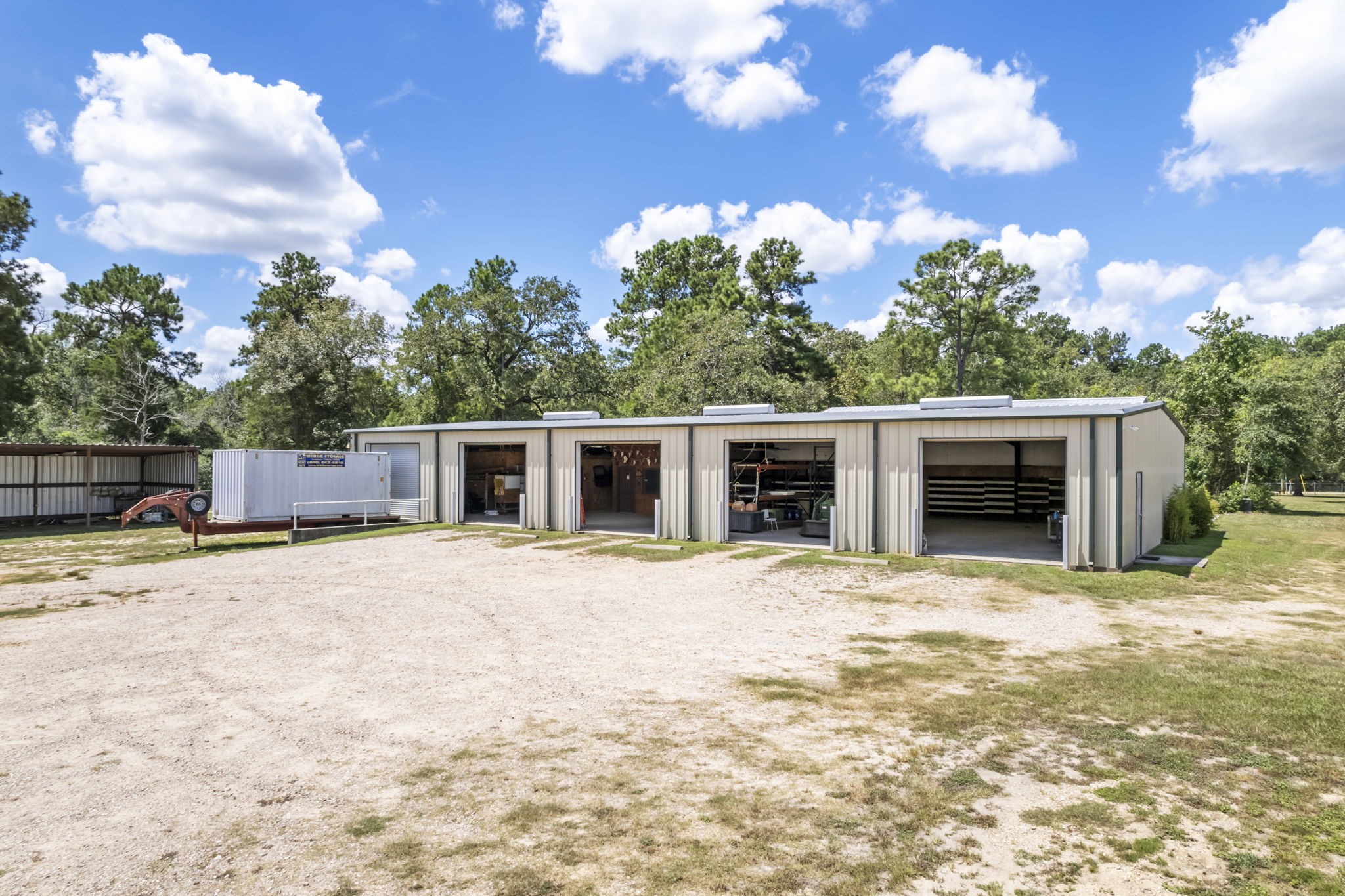 11534 Clint Parker Road Conroe, TX 77303 - Photo 28 of 50 a house with trees in the background