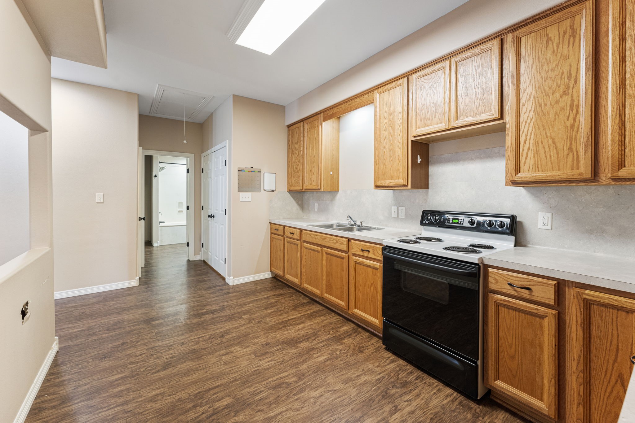 11534 Clint Parker Road Conroe, TX 77303 - Photo 34 of 50 a kitchen with stainless steel appliances granite countertop a stove a sink and a refrigerator